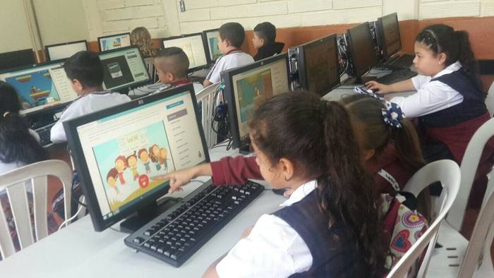 Students in Colombia using the distance learning portal on classroom computers